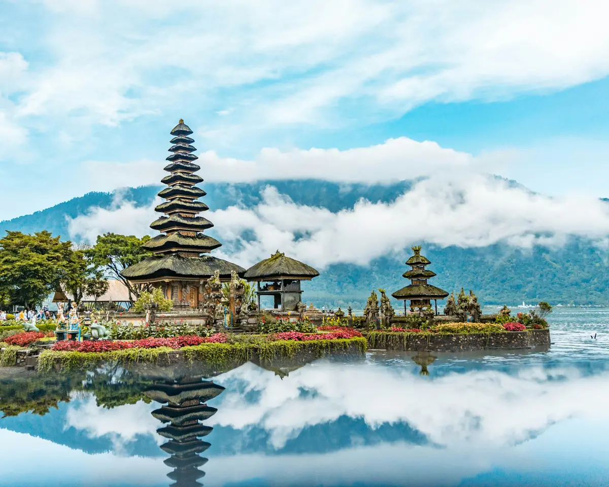 Ulun Danu Beratan Temple on Lake Beratan, Bali, reflected in the water among low clouds