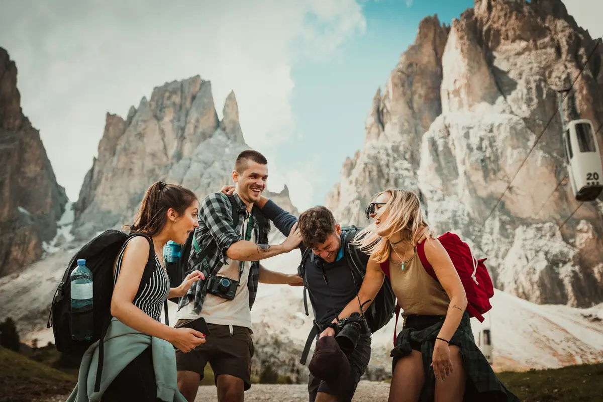Friends laughing on a hike in the mountains